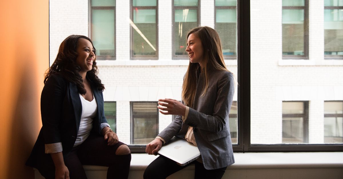 Young Accountants discussing college degrees