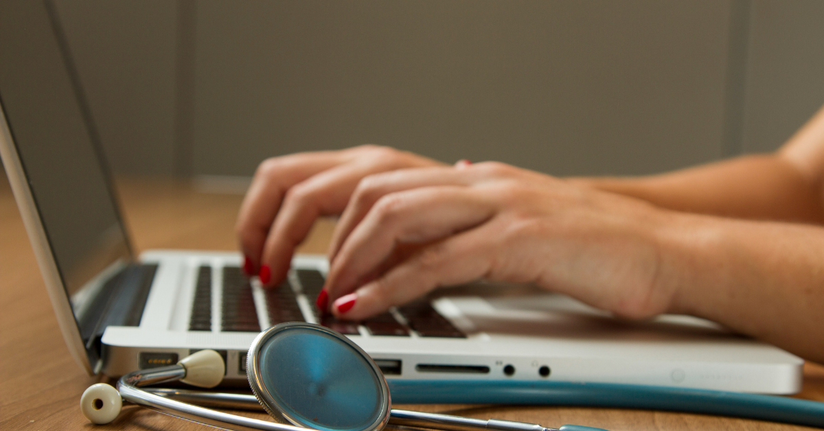 BSH healthcare person typing with statoscope